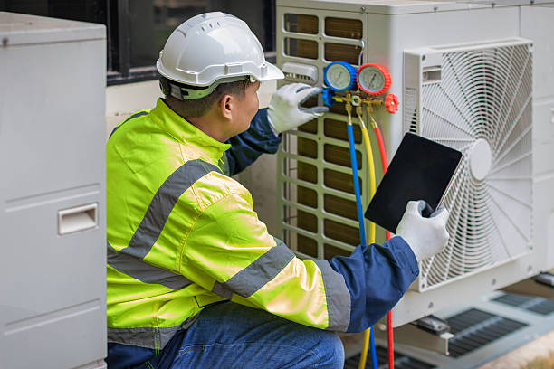 Professional Air Conditioning Repair technician working in West Olive, MI